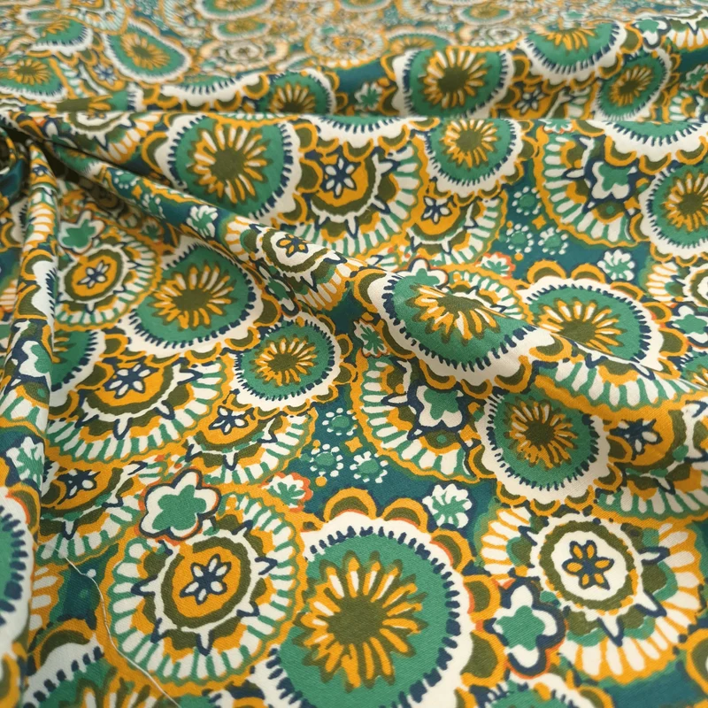 Tessuto Cotone H 145 cm - CERCHI IN FIORE/OTTANIO E SENAPE