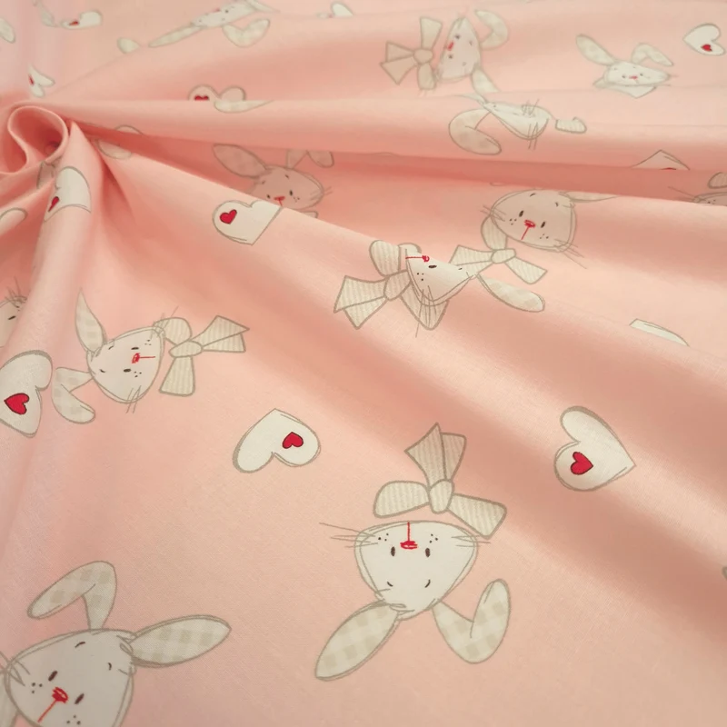 Tessuto Cotone H 160 cm - CONIGLIETTI E CUORI/ROSA TENUE