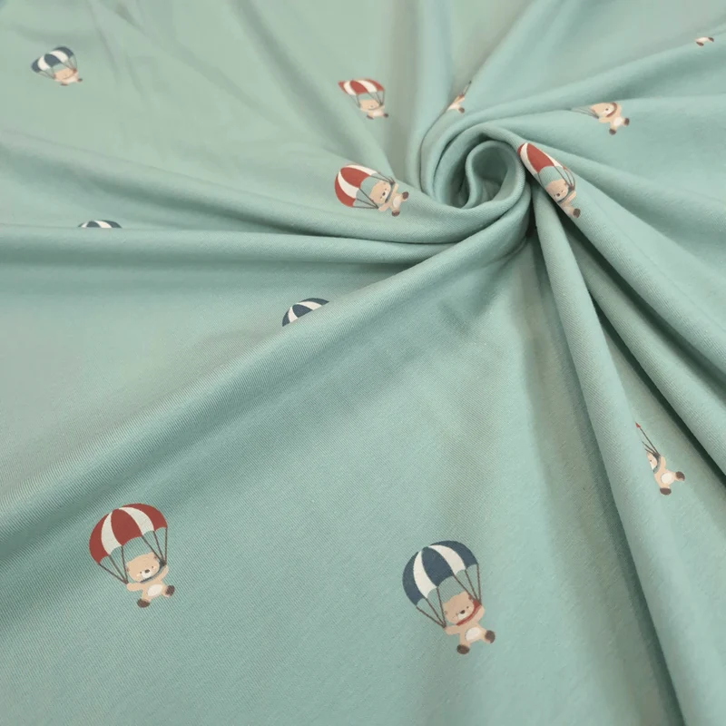 Jersey di Cotone H 150 cm - ORSETTI IN MONGOLFIERA/ACQUA MARINA