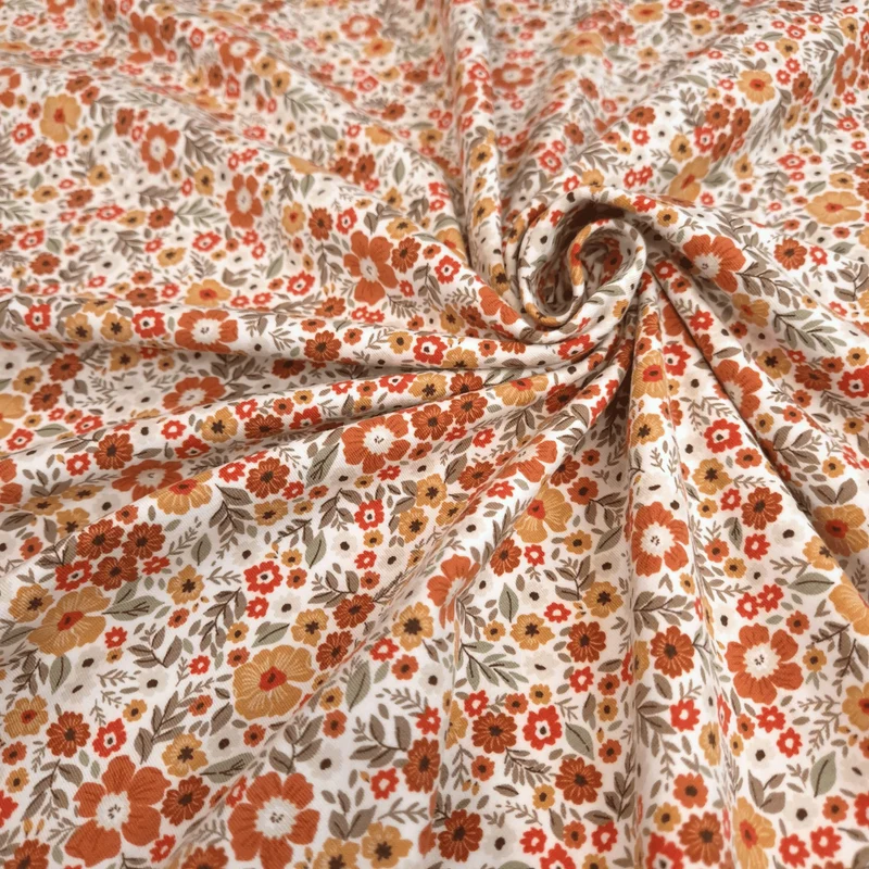 Jersey di Cotone H 150 cm - FIORELLINI RUGGINE/OCRA