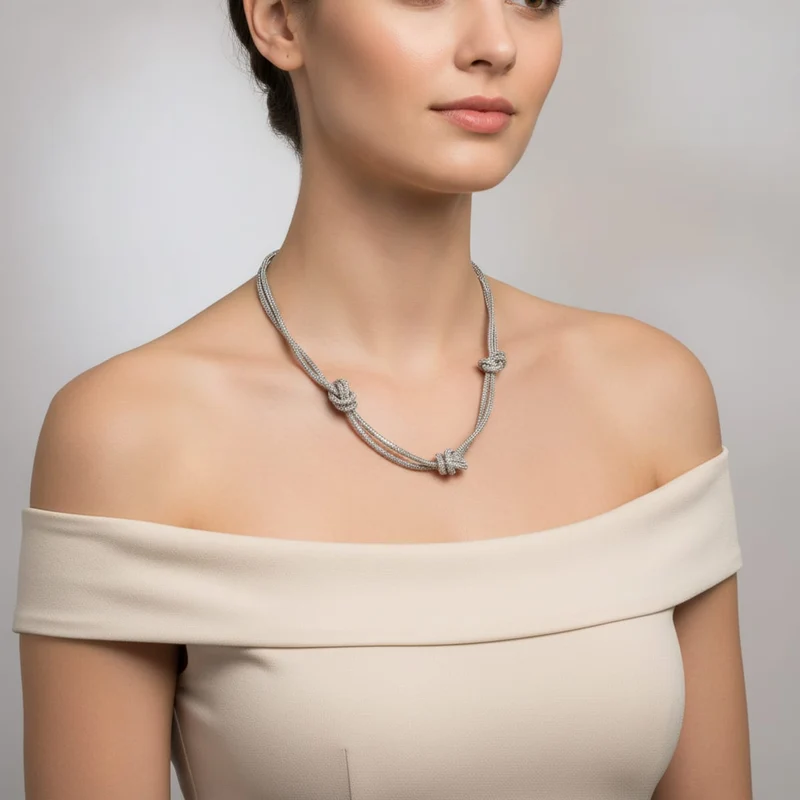 Collana tubolare con strass e nodi - Trasparente