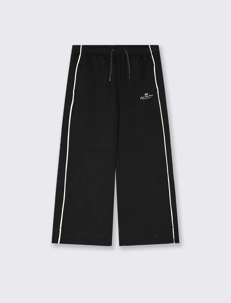 Jogger a gamba larga in tessuto tecnico - Nero
