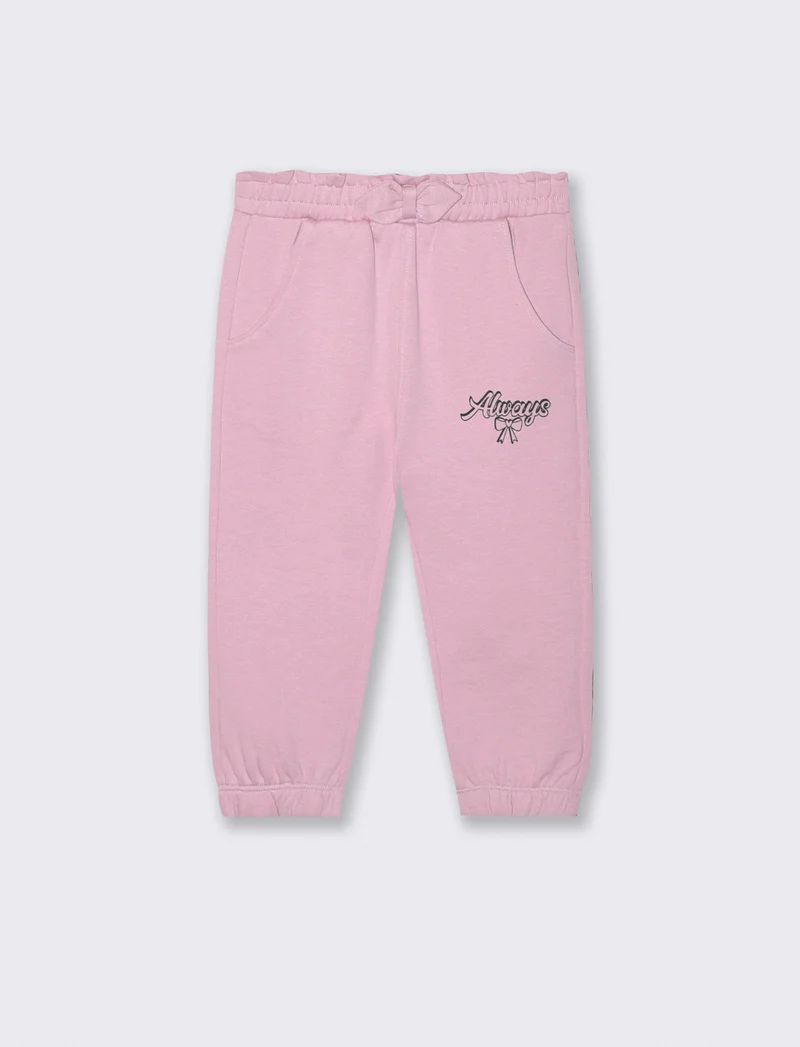 Jogger in cotone con fiocco e patch - Rosa polvere
