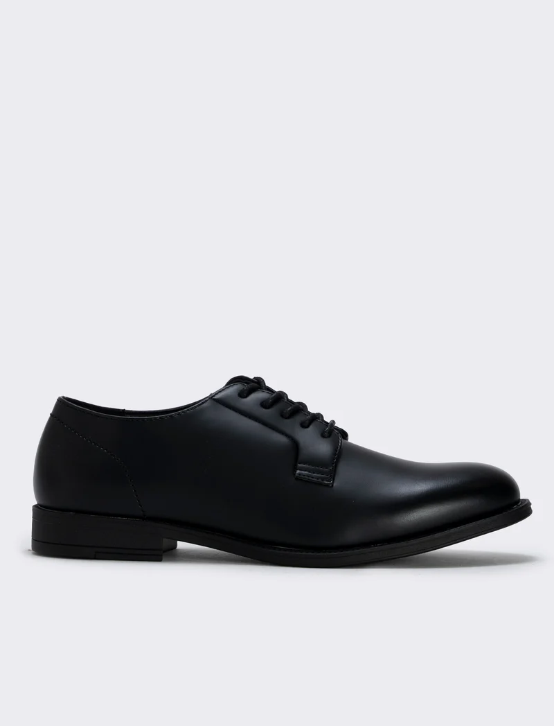 Scarpa stringata uomo in poliuretano nero - Nero