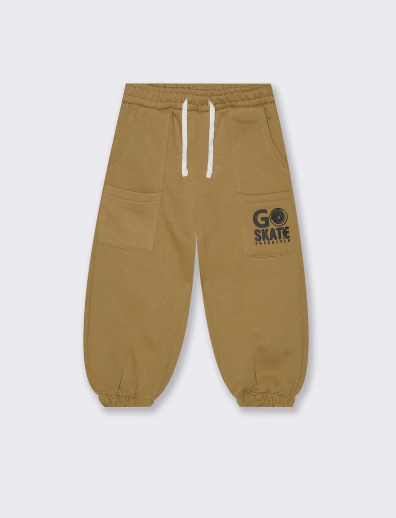 Jogger con tagli e stampa - Beige