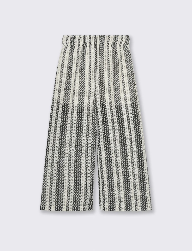 Pantaloni in tessuto a rete traforato. - Fantasia