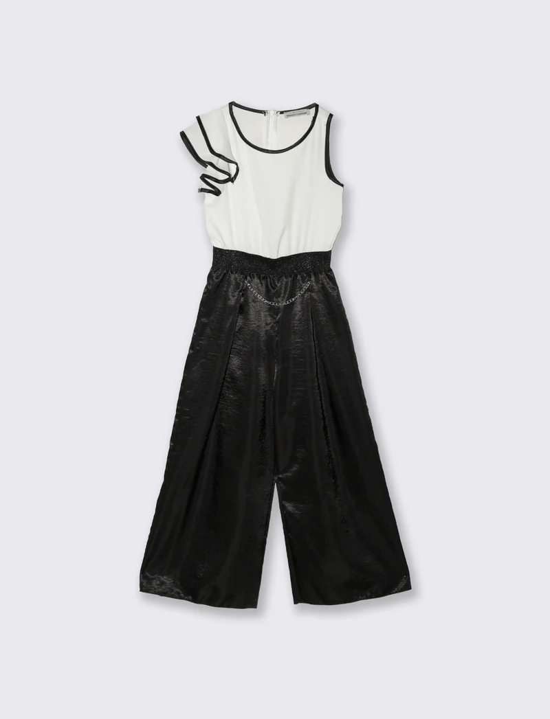 Salopette elegante da bambina con tessuti a contrasto. - Nero