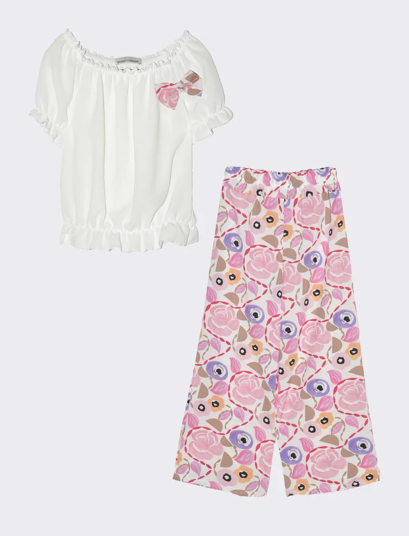 Completo da bambina con blusa e pantaloni fantasia. - Rosa