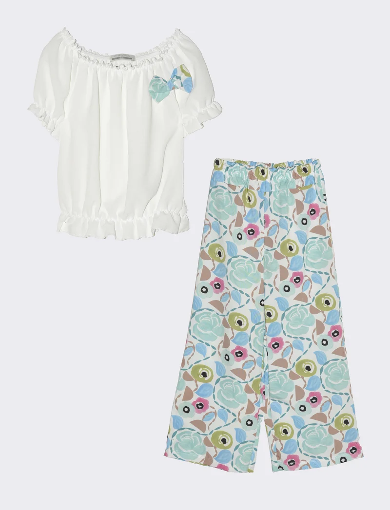 Completo da bambina con blusa e pantaloni fantasia. - Azzurro