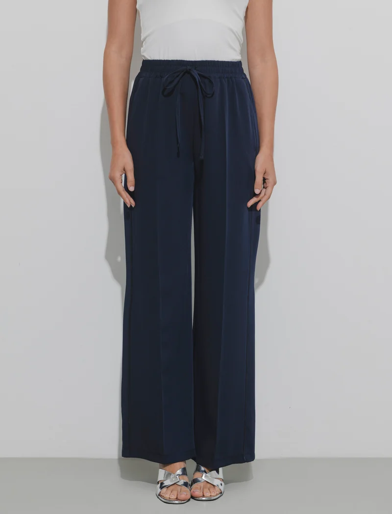 Pantalone palazzo con vita elasticizzata e coulisse regolabile. - Blu