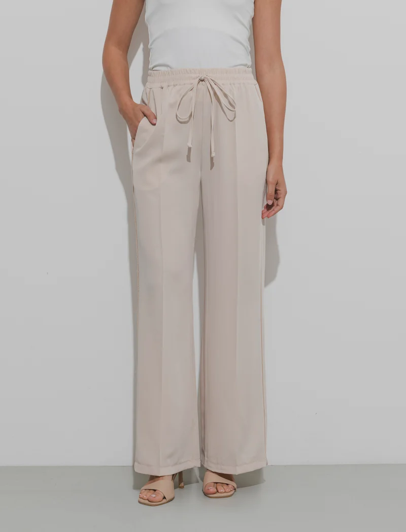 Pantalone palazzo con vita elasticizzata e coulisse regolabile. - Beige