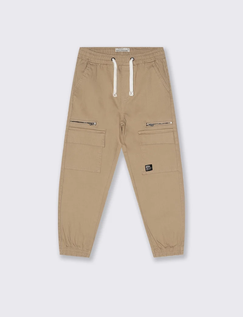 Jogging con tasconi. - Beige