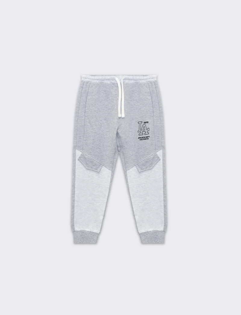 Jogger bicolor da bambino - Grigio mel.