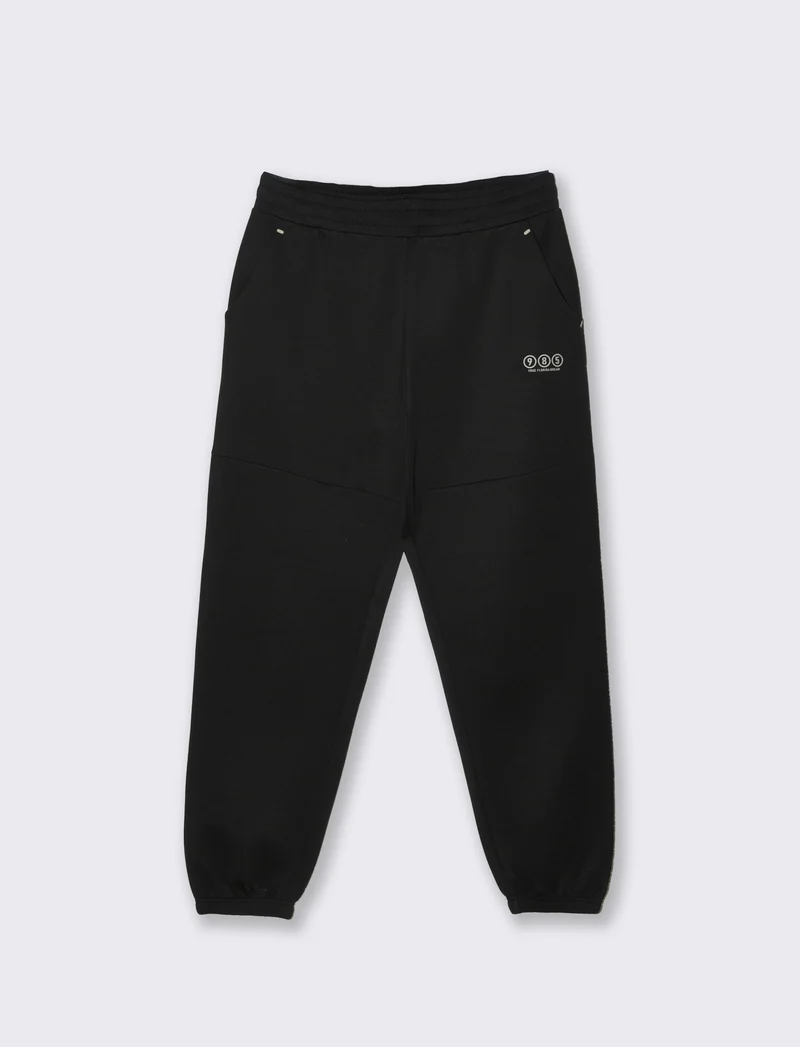 Pantaloni jogger in interlock con tasche - Nero