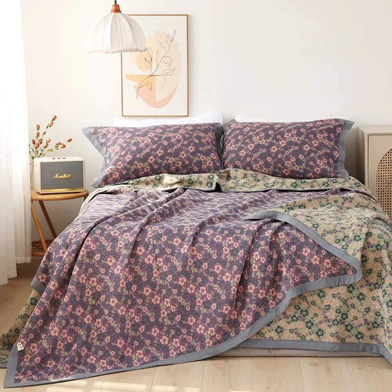 Trapunta reversibile in garza di cotone jacquard floreale
