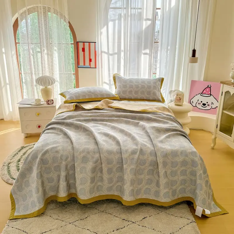 Trapunta reversibile in garza di cotone jacquard con motivo geometrico jacquard