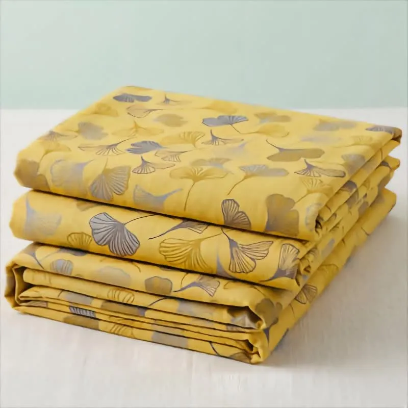 Coperta trapuntata in cotone color senape e ginkgo