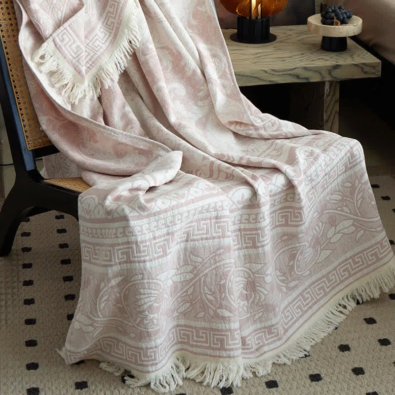 Coperta in cotone rosa con motivo floreale a volute