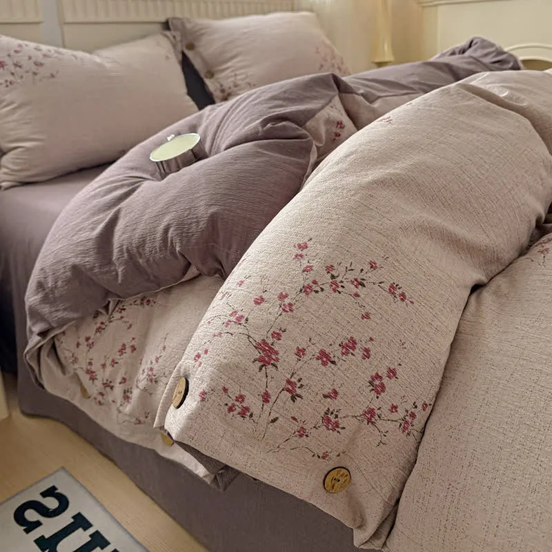 Elegante set di biancheria da letto con fiori di prugna