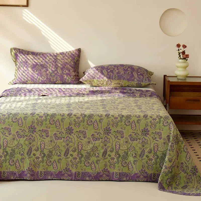 Copriletto in garza di cotone jacquard con motivo floreale astratto