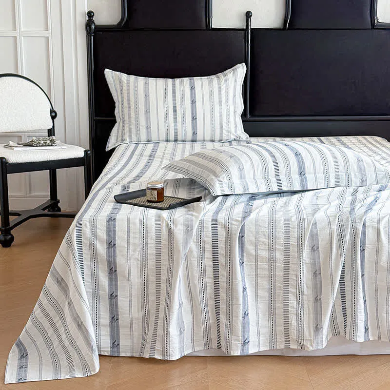 Copriletto in puro cotone jacquard a righe