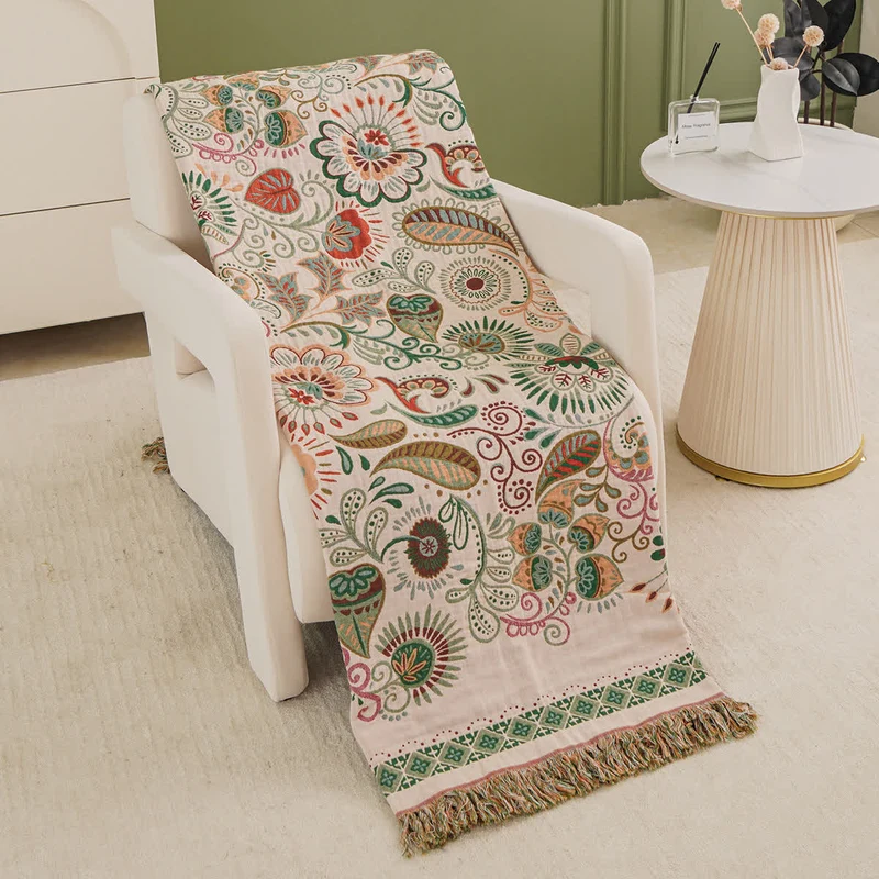Coperta in garza di cotone con motivo paisley retrò e nappa