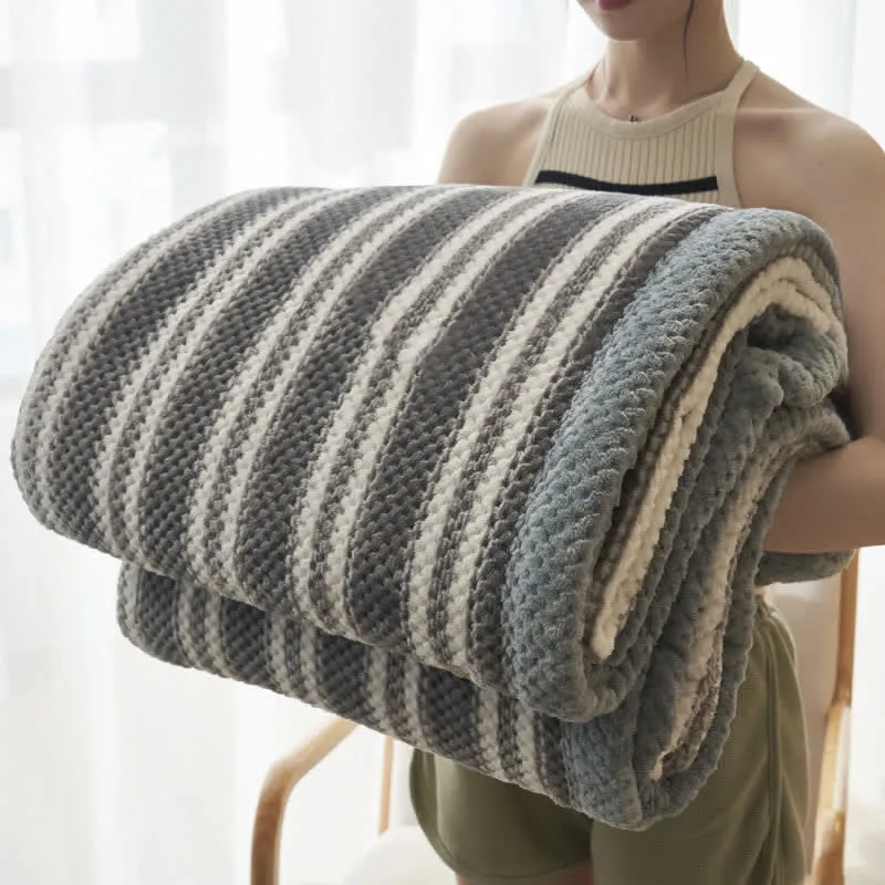 Coperta in pile di corallo a righe
